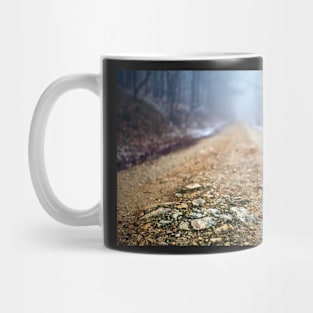 Foggy road in the forest Mug